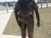 installation of bronze statue of Ronnie Brown at Memorial site