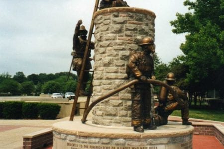 Bronze firefighter in uniform with hose, ladder child statues