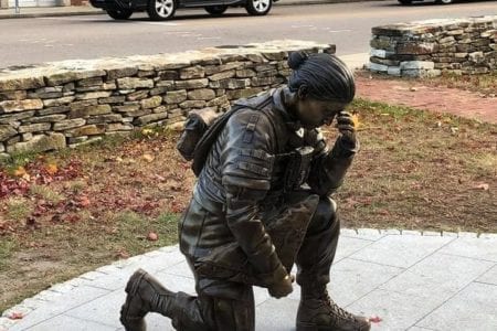 Bronze military memorial kneeling female soldier in uniform statue