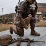 bronze kneeling female soldier statue