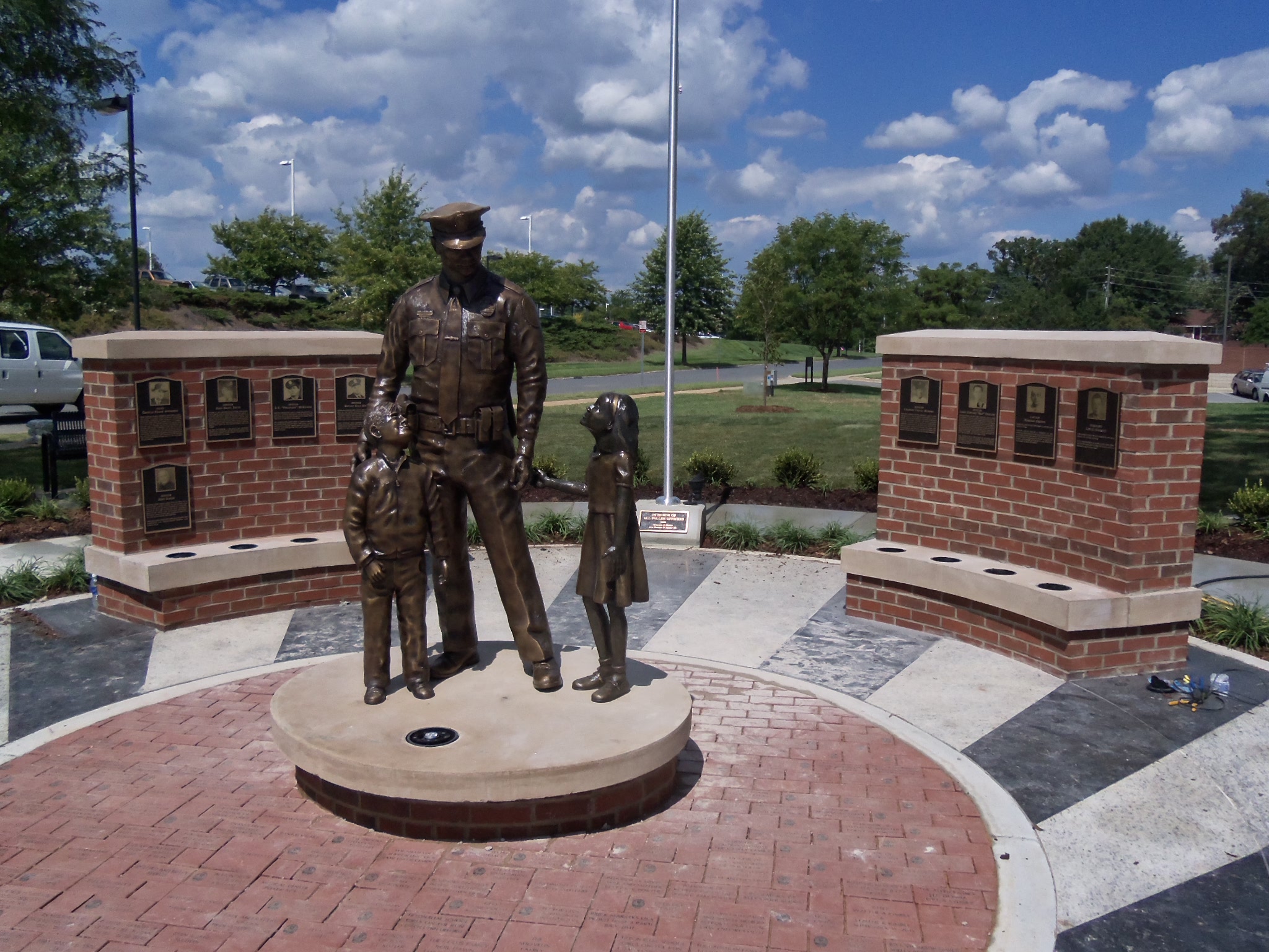 Protector statue with officer and child