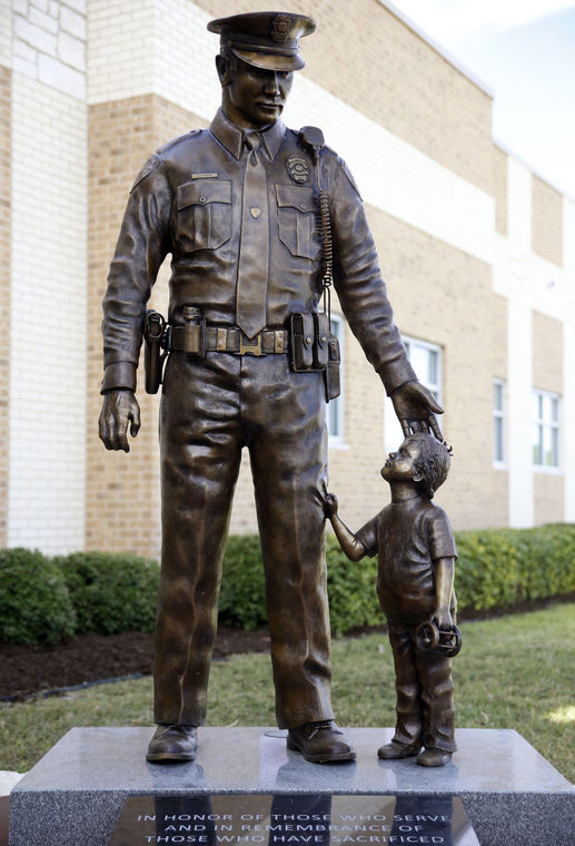 officer and child statue