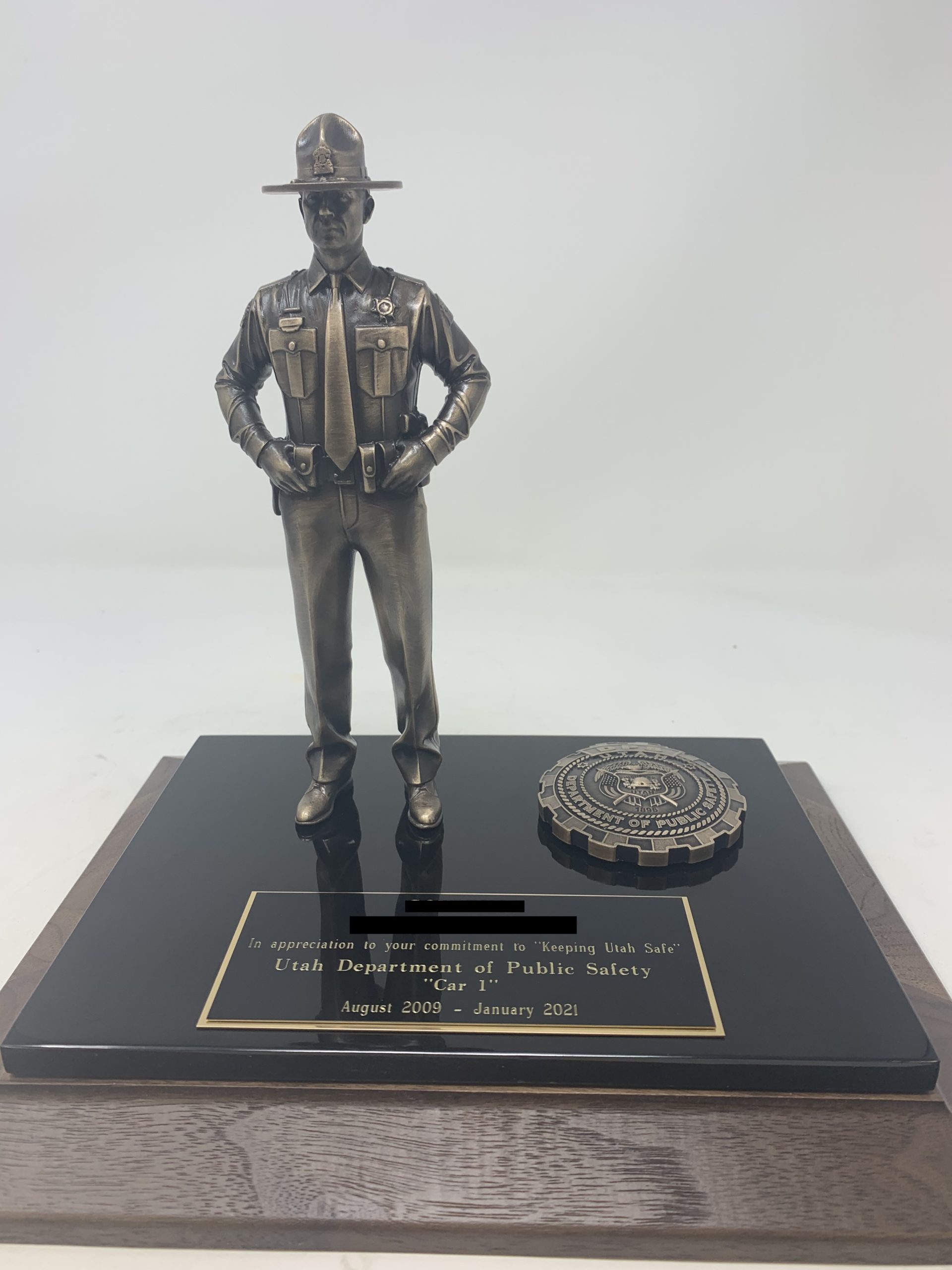 bronze state trooper statue with plaque