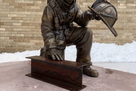 Bronze firefighter statue