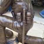 Custom equipment on police officer bronze monument