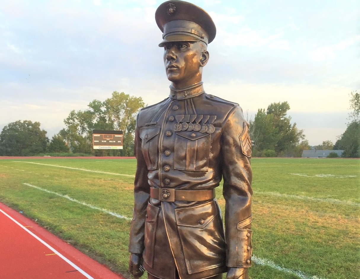Bronze military memorial US Marine soldier Brian St Germain in dress uniform
