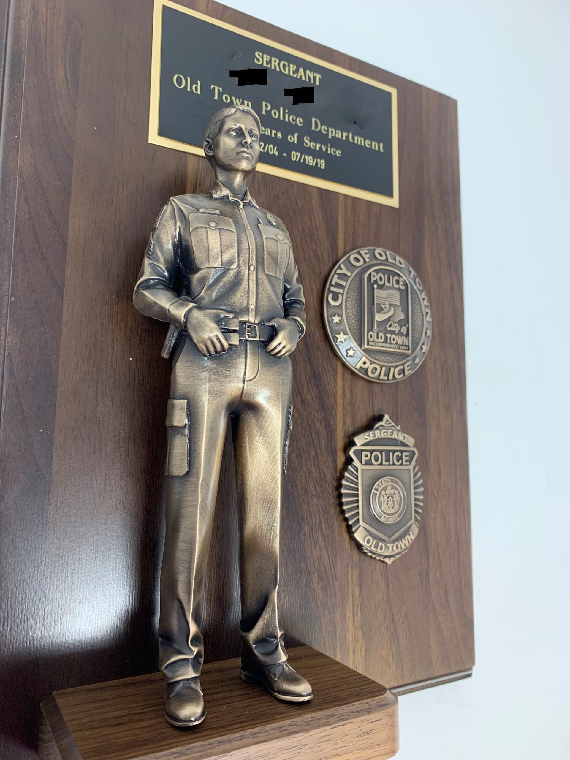 female police figurine on an award