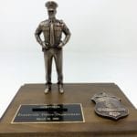 mini bronze police figurine