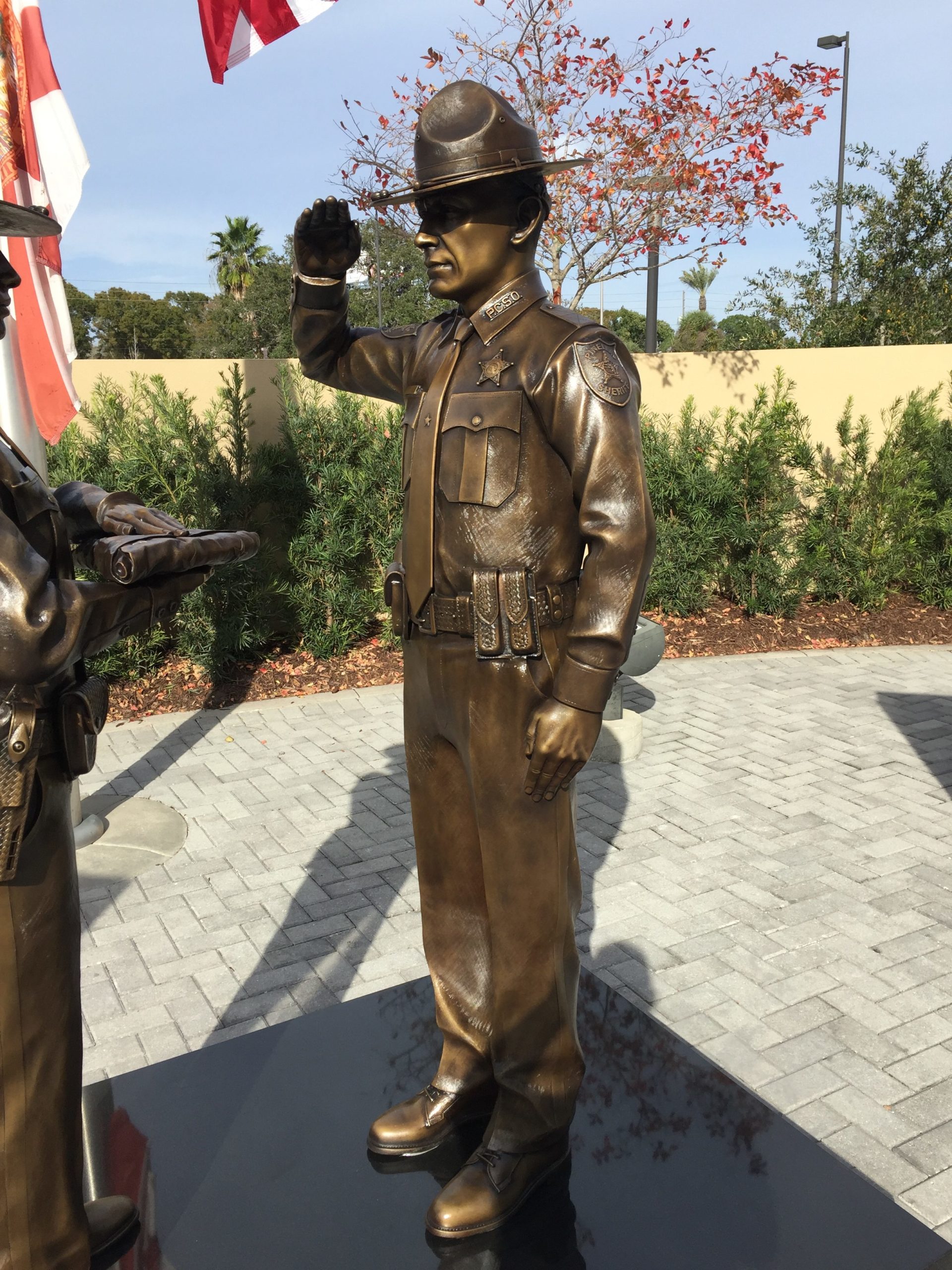 saluting officer sculpted with your uniform, patches, badges, equipment, and gear.