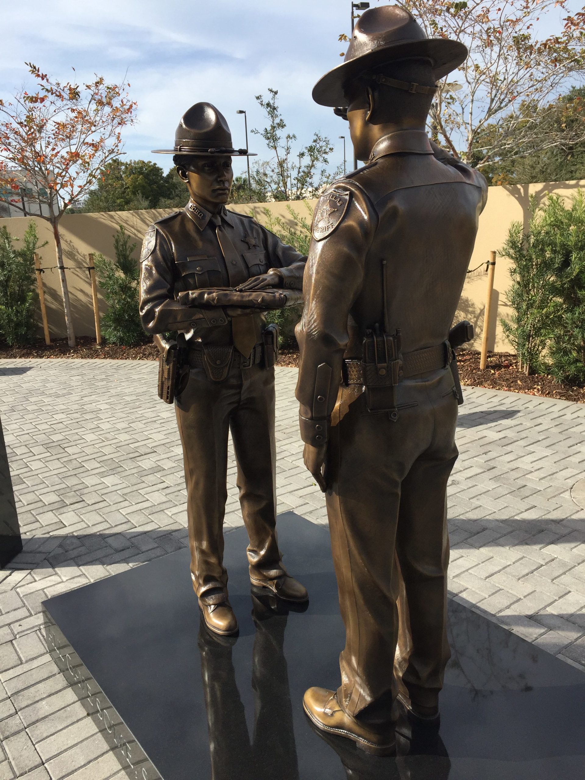 Bronze statues with equipment and gear using same makes and models of the items used by your department.