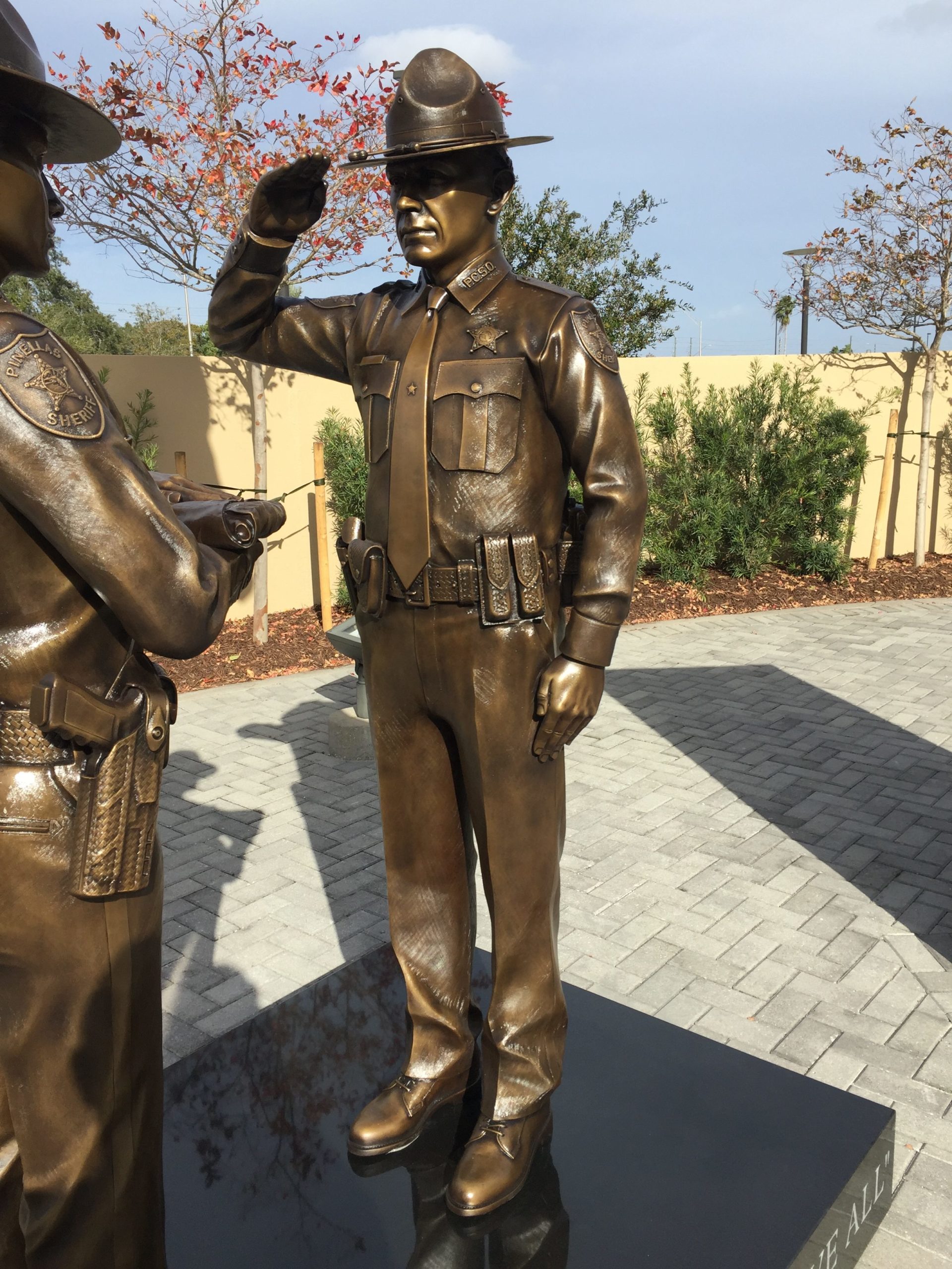 Bronze saluting officer with custom uniform and patches