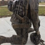 Bronze Call to Duty Soldier with the patches, equipment, and gear are all customized