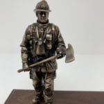 bronze firefighter with axe