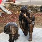 kneeling soldier state outdoors