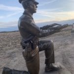 kneeling outdoor police statue