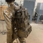 clockmaker statue backpack