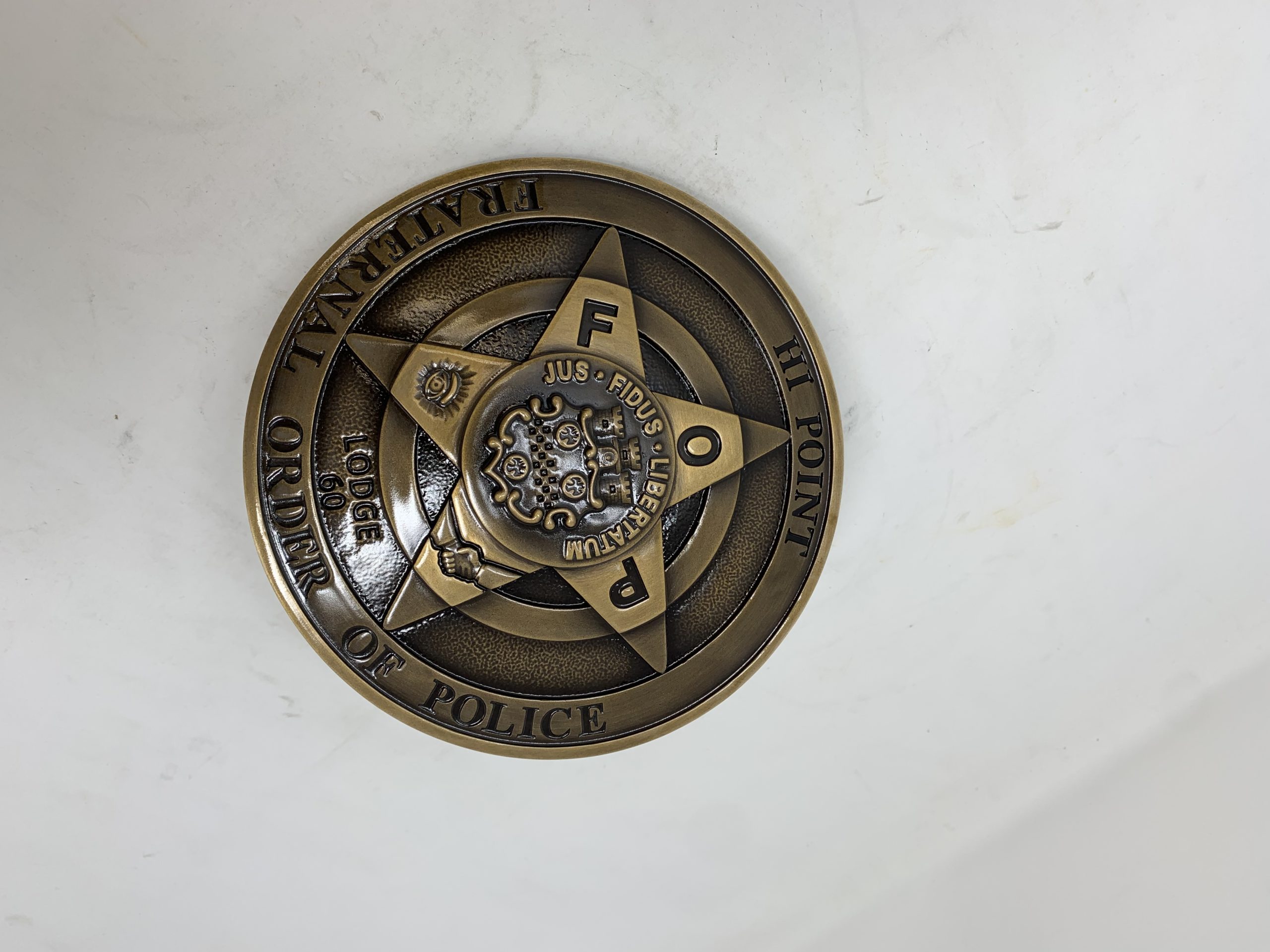 bronze FOP medallion on a wall