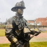 closeup of firefighter memorial statues