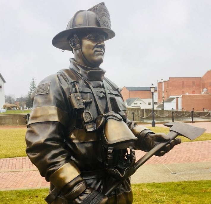 closeup of firefighter memorial statues
