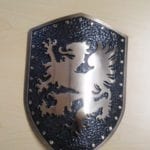 bronze logos on a shield