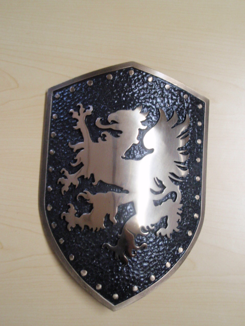 bronze logos on a shield