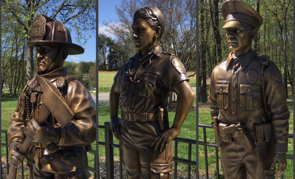 Bronze police officer, firefighter and EMT in uniform statues