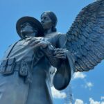 fallen officer with angel statue