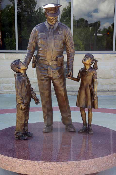 police and child statue
