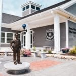 police officer bronze statue displayed outdoors