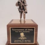 wounded warrior statue with bronze plate