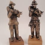 2 bronze firefighter sculptures