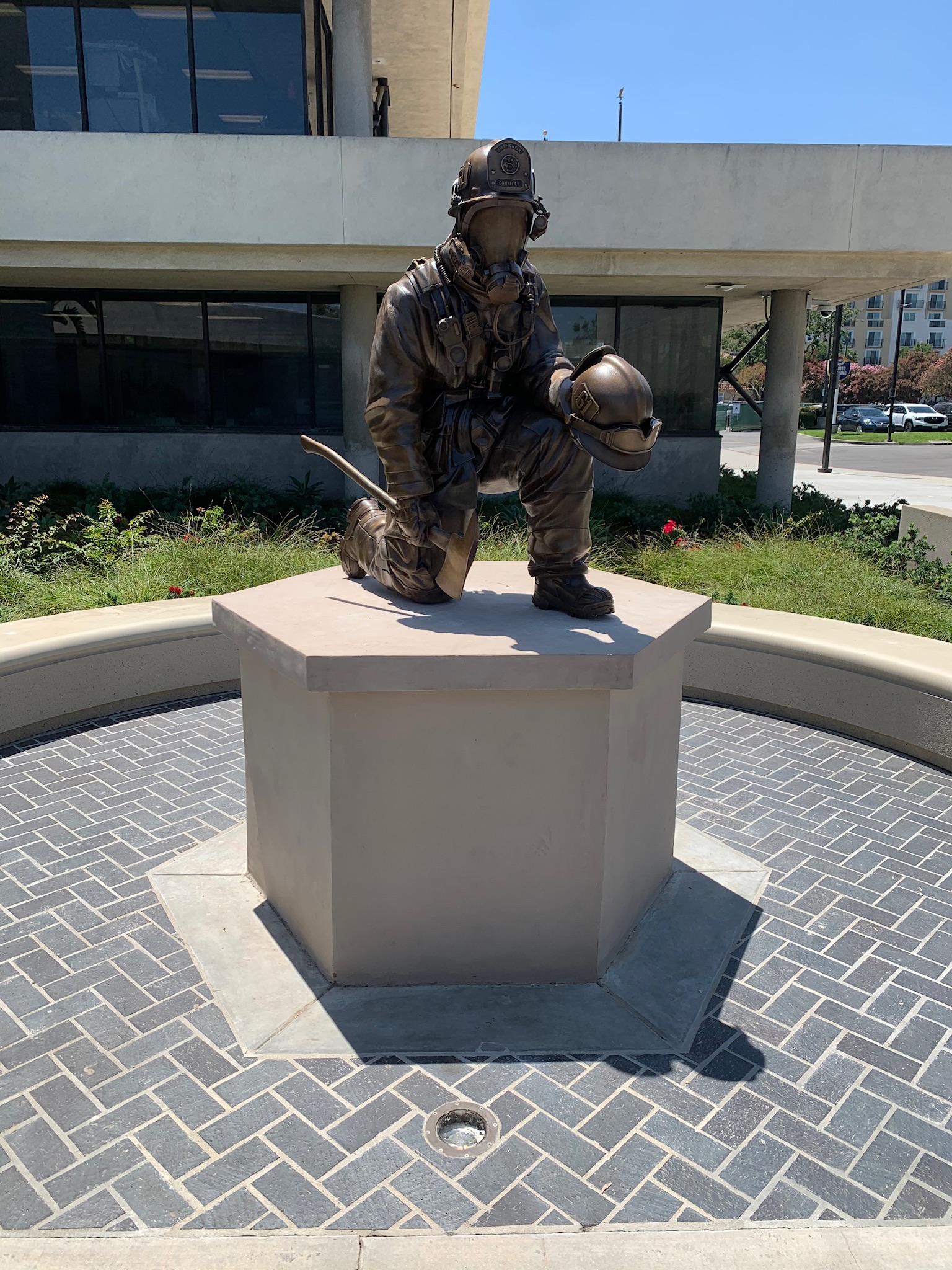 life size firefighter statues on pedestal