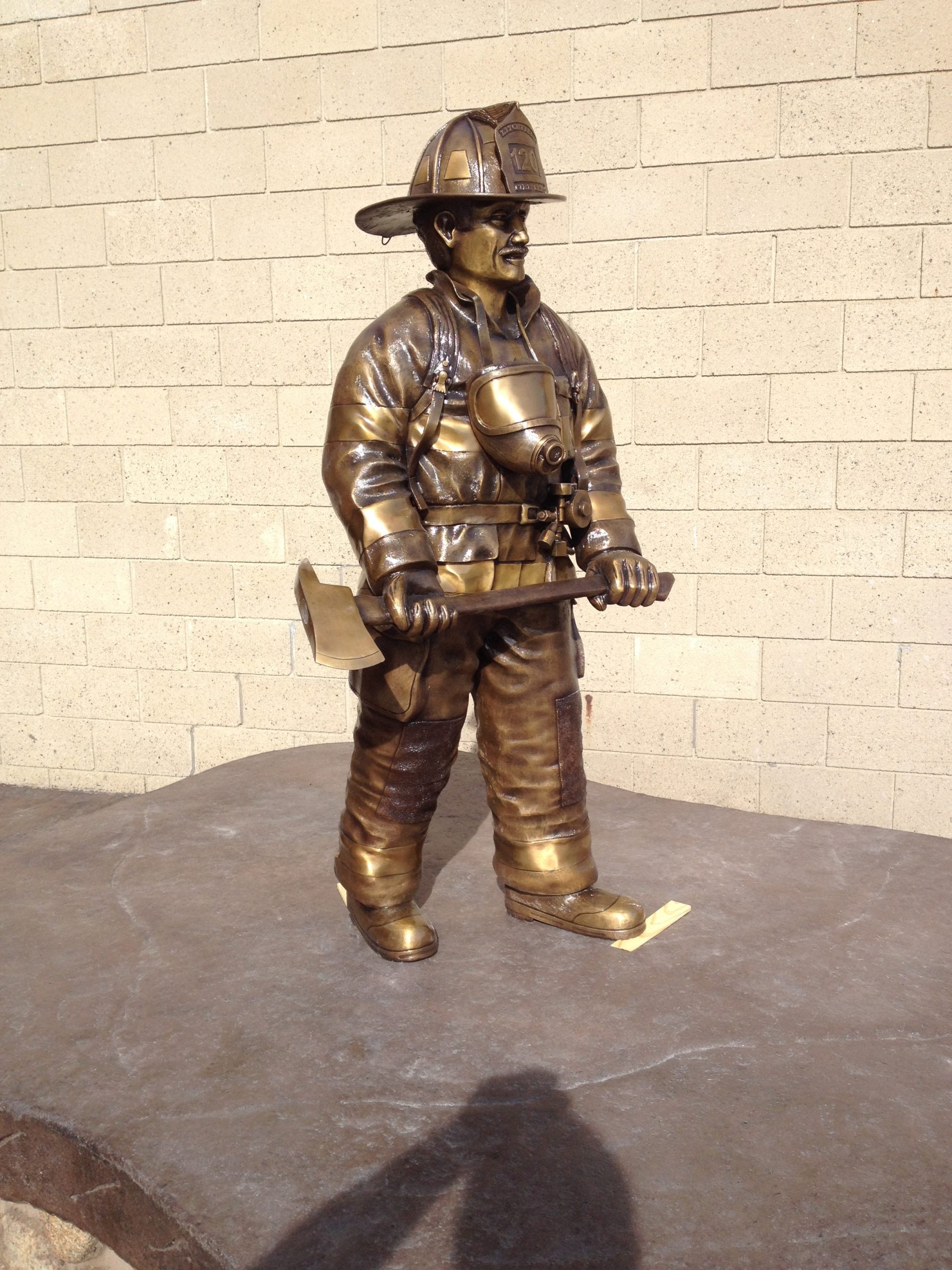 large walking firefighter memorial statue