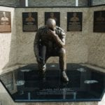 Kneeling bronze police officer memorial front